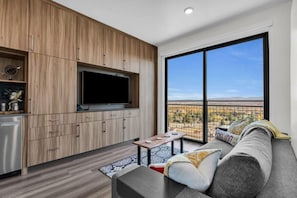 Stylish decor and plush furnishings make the living room the perfect spot to relax and unwind after a busy day of adventures.
