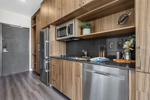 The fully stocked kitchen has stainless steel appliances, Nespresso, a toaster oven, and basic cookware so you can easily prepare delicious meals.