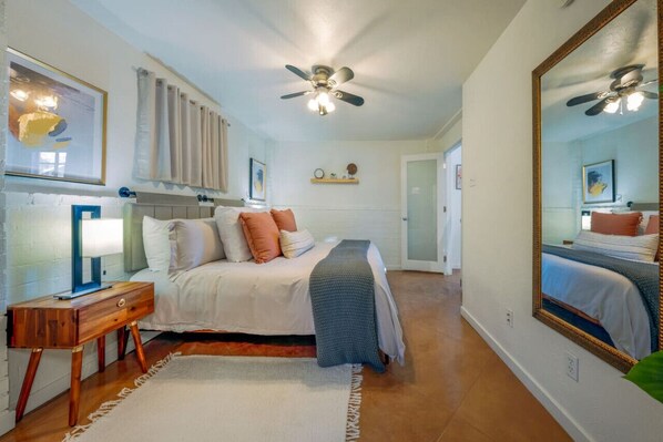Bedroom with king-size bed, and closet/laundry room