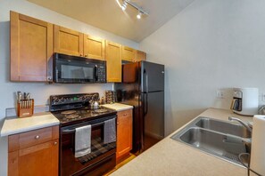 Well-equipped kitchen, stocked and ready for your stay (no dishwasher)
