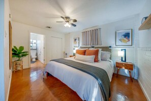 Bedroom with king-size bed, and closet/laundry room