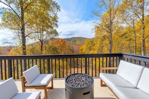 Sitting on 21 acres built into the mountainside, the views from the expansive back porches are jaw-dropping