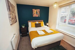 Relax and recharge in this stylishly designed bedroom
