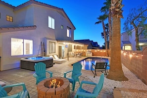 Pool and hot tub at night