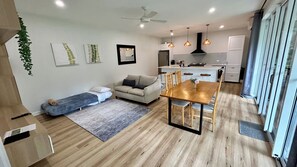 Showing one sofa bed made up with linen (the other is behind the couch)