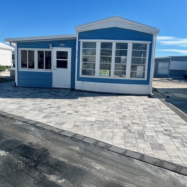 Brand new unit with beautiful pavers front and back of the house.