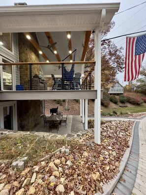 Two levels of outdoor seating with covered roof and deck.