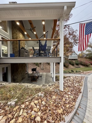 Two levels of outdoor seating with covered roof and deck.