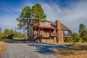 Perched at the top of a hill, this cabin home is your next mountain getaway