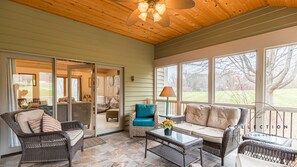 Sip your morning coffee (or your evening wine) on the fabulous screened porch