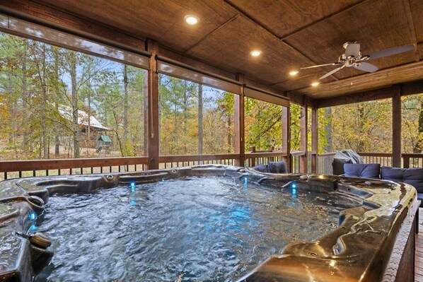 Soak in luxury on our hot tub deck, where nature and relaxation meet under the canopy of trees.