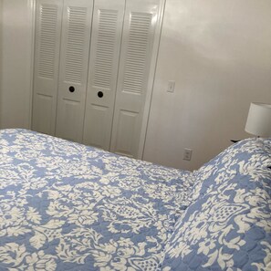 Bedroom with queen bed closet.