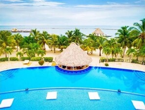 Resort pool with swim-up tiki bar