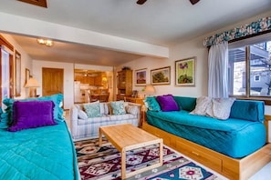 The living room features 2 comfortable daybeds.