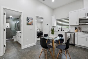 Cool Finished Concrete flooring throughout, space for 4 dining at the kitchen table