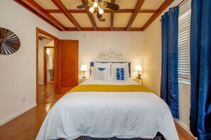 Perfectly styled Bedroom 2 with cozy queen bed for a restful night's sleep