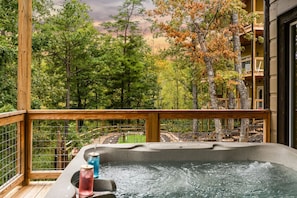 Evenings are better here—bubbling water, private deck, and breathtaking views.