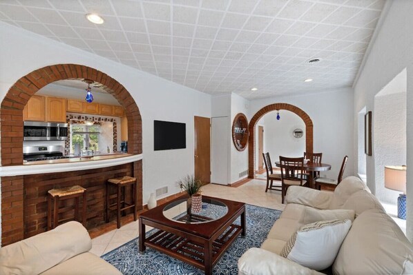 Living area with breakfast bar/view into kitchen!