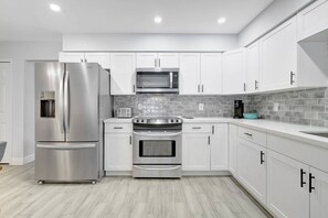 Our cottage features and updated kitchen with stainless steel appliances and quartz counters