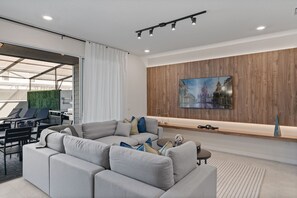Unwind in Elegance: Spacious Living Room with Smart TV.