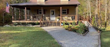 Welcome. Parking in front as well as plenty of parking on other side of cabin