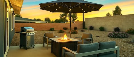 Large backyard with fire pit and BBQ grill