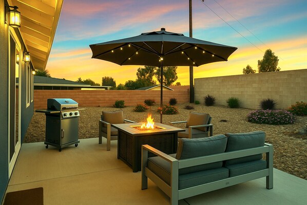 Large backyard with fire pit and BBQ grill