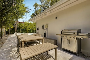 BBQ Grill with outdoor seating. Perfect for hosting!