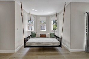 A swinging bed available in bedroom #1!