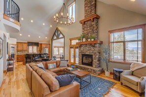 Bright and airy open concept floor plan with a gas fireplace and elevated deck