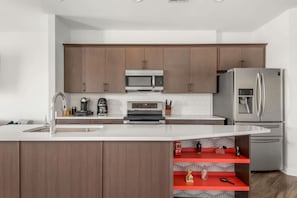 Fully stocked kitchen with multiple coffee options, beans, grinder, Nespresso