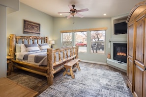 Master bedroom with fireplace and attached bathroom