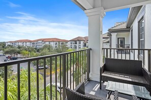 Balcony Bliss: Savor the beauty of nature from your private vantage point – a balcony with an enchanting lawn view, perfect for relaxation and rejuvenation