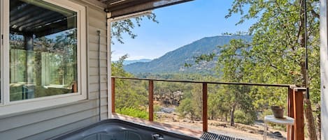 Relax in the hot tub while looking over the sierra mountains and listen to the north fork river below