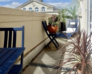 Bright patio with furniture to enjoy the fresh air and scenes In private. 