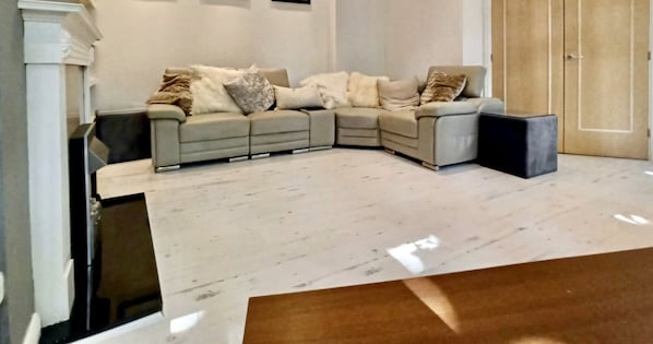 Luxurious Glam living room with seating for 8.
