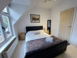 Bedroom two with ensuite bathroom and storage for clothes. 