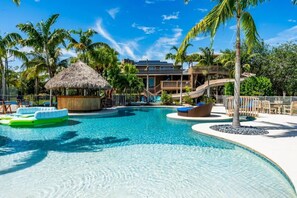 Lagoon-Style Pool Oasis with Lush Palms: Tropical, Refreshing Retreat