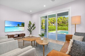 The warm lighting and carefully chosen decor invite you to relax and unwind, setting the stage for an unforgettable stay in this meticulously designed Airbnb. Enjoy watching your "bingeable" shows on the large ROKU TV, or embrace the views of the pool.