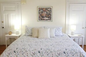 A king-sized bed in the large master bedroom.