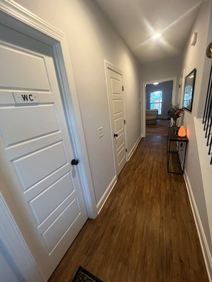 Entryway with convenient half bathroom.