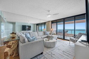 Spacious seating with floor-to-ceiling views of the coastline.