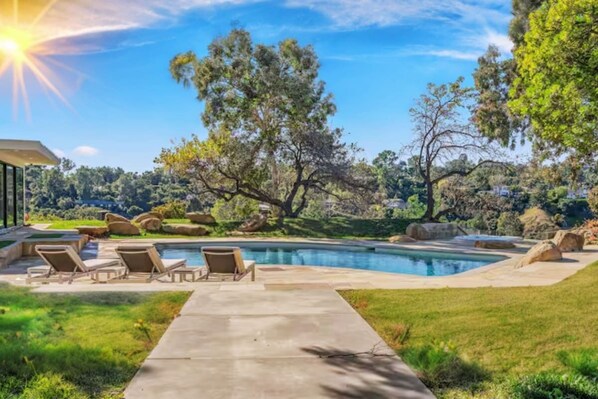 Relax on comfortable loungers or take a refreshing dip while soaking in the natural beauty and peaceful ambiance. Perfect for unwinding and embracing nature in a luxurious setting.