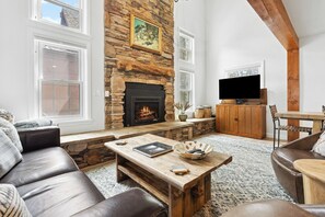 Living room with gas fireplace and lots of natural light