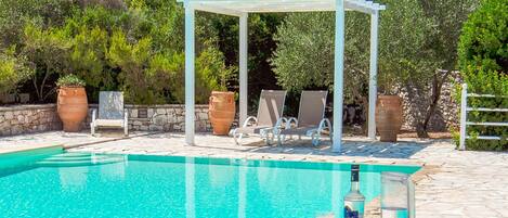 Eleni offers a shared pool for a communal swim