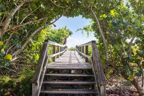 A peaceful pathway leading you straight to the sandy shores