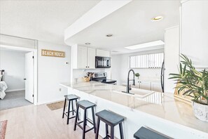 Modern and stylish kitchen with bar seating and plenty of natural light