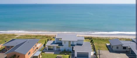 Aerial view of property right on the beach front