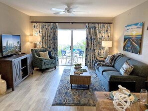 Living room features a door to the private patio.