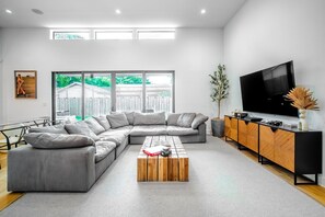 Enjoy lush backyard views from indoors thanks to the seamless design.